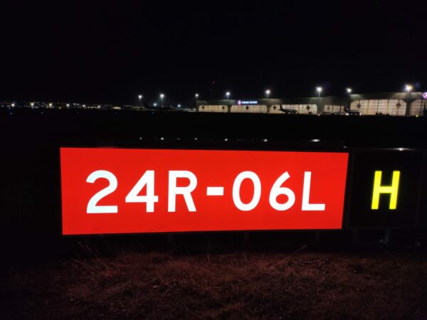 Airport Guidance Sign Red Illuminated Night time