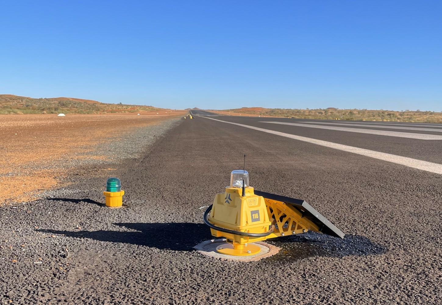 S4GA SP-401 solar runway light (right) installed next to the portable threshold light (left)